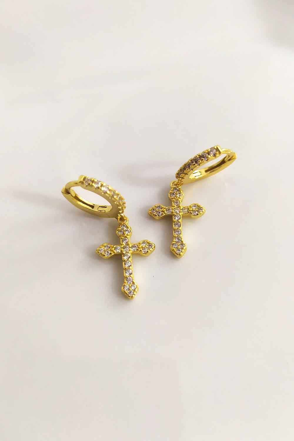 Hoop earrings with crosses. Sterling silver jewelry with 18k gold plating.